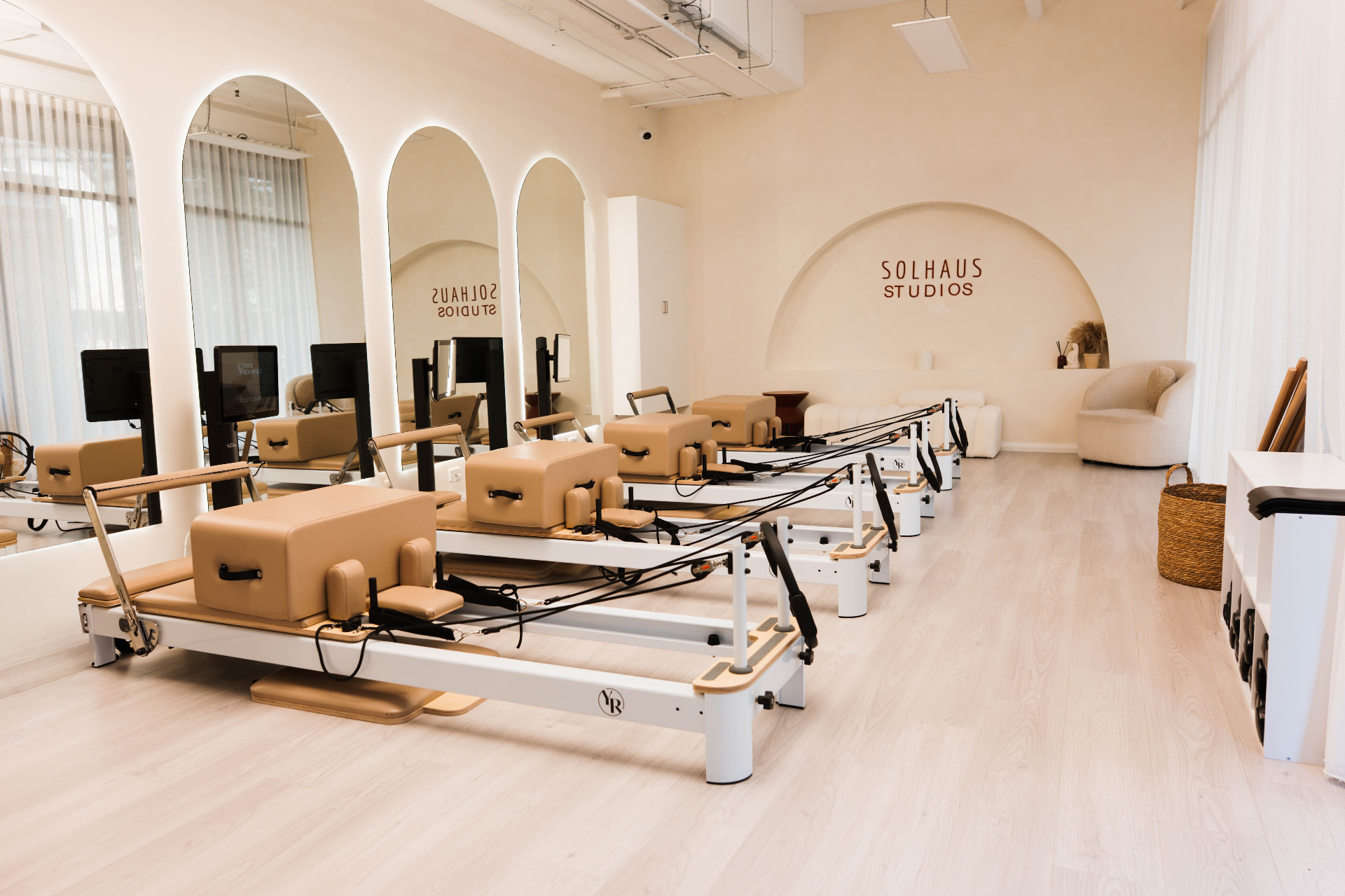 The Solhaus reformer studio with arched mirrors and natural light